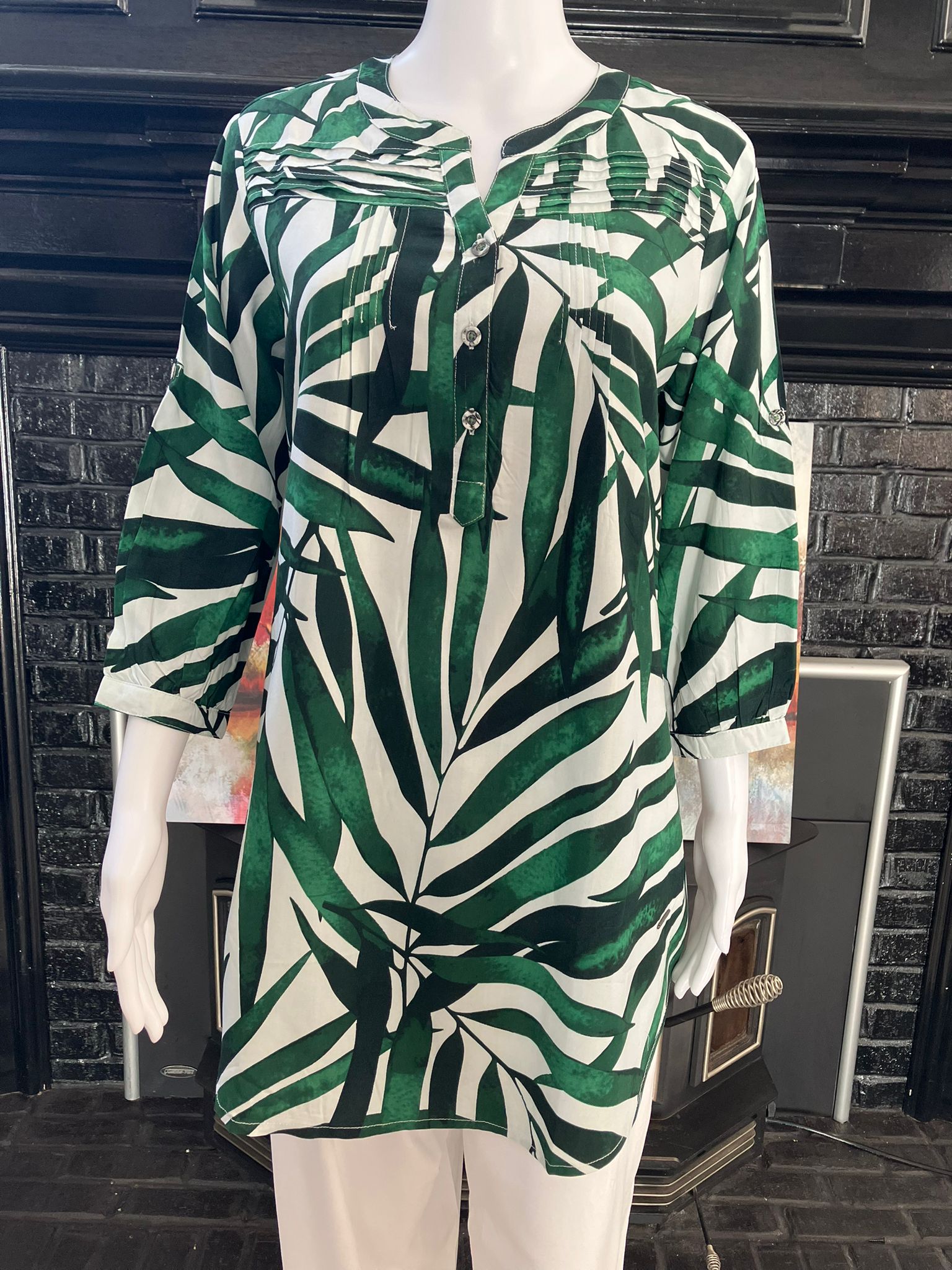 Upgrade your wardrobe with our Printed Tunic Short Dress. Featuring a trendy print and relaxed fit,